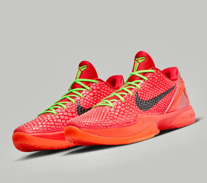 Side view of Kobe Bryant's red and green Nike sneakers.